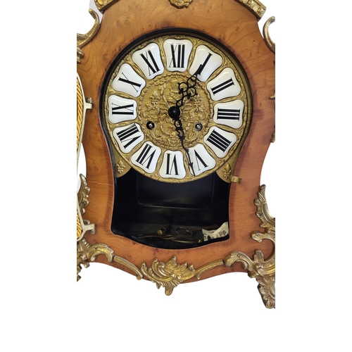 2 - LAURIS, A 20TH CENTURY WALNUT AND GILT BRASS BRACKET CLOCK
Having a pierced brass scrolled finial an... 