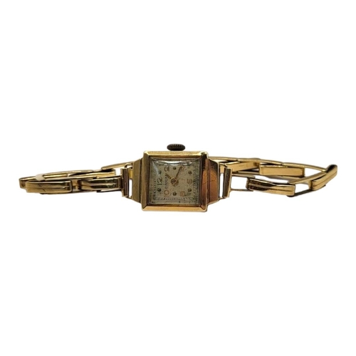 20B - DAMAS, AN EARLY 20TH CENTURY 9CT GOLD LADIES’ WRISTWATCH
Rectangular silver tone dial, on an expandi... 