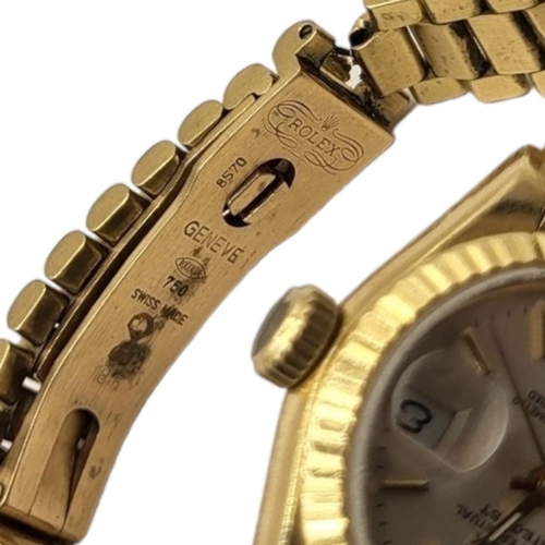 28B - ROLEX, DATEJUST, A VINTAGE 18CT GOLD LADIES’ WRISTWATCH
Having a silver tone dial with calendar wind... 