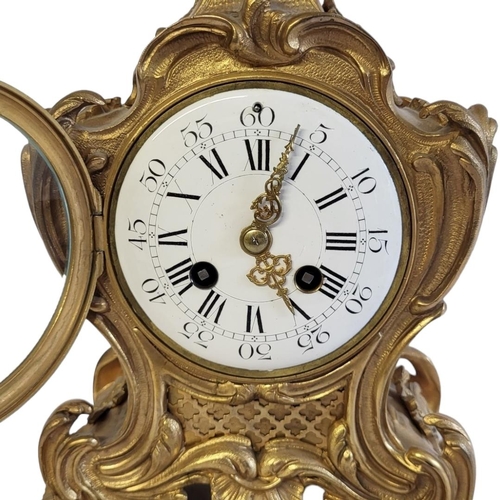 3 - SAMUEL MARTI, A 19TH CENTURY GILT BRONZE MANTLE CLOCK
Having a bouquet finial,scrolled rococo case a... 