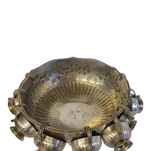 34 - A LARGE 20TH CENTURY SILVER  PLATE ON COPPER  PUNCH BOWL AND CUPS
Having a gadrooned border,lion mas... 