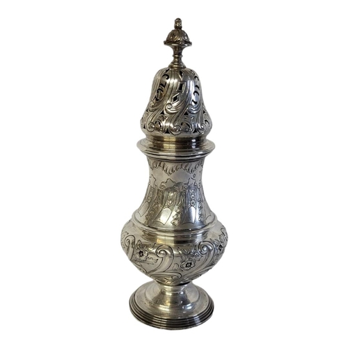 39 - A LARGE VICTORIAN SILVER SUGAR SIFTER/CASTOR 
Having a pierced dome and embossed decoration, hallmar... 