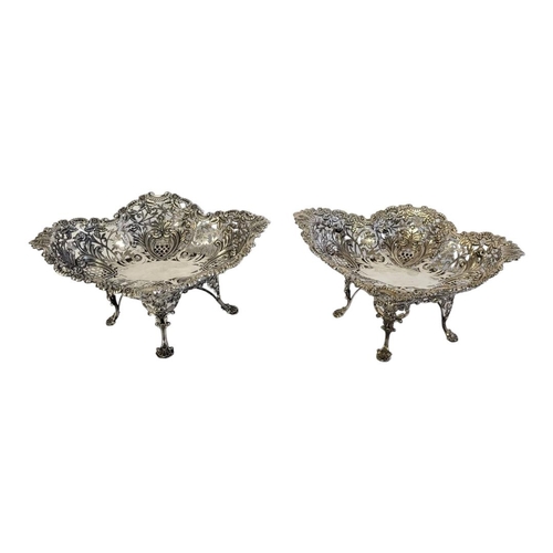 40 - A LARGE PAIR OF VICTORIAN SILVER SWEETMEAT DISHES
Lozenge form with fine scrolled floral border,pier... 