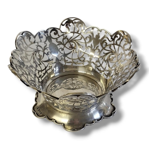 41 - AN EDWARDIAN SILVER CIRCULAR SWEETMEAT BASKET
With scrolled edge and  pierced decoration, hallmarked... 