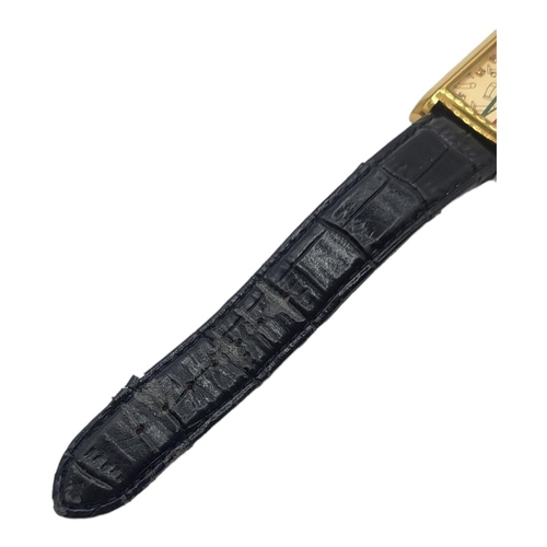 43A - GUCCI, A VINTAGE GOLD PLATED GENT’S WRISTWATCH
Rectangular form dial with Gucci monogram, on a black... 