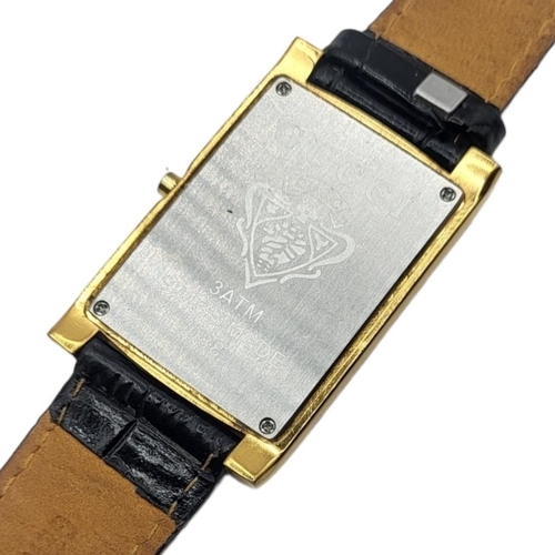 43A - GUCCI, A VINTAGE GOLD PLATED GENT’S WRISTWATCH
Rectangular form dial with Gucci monogram, on a black... 