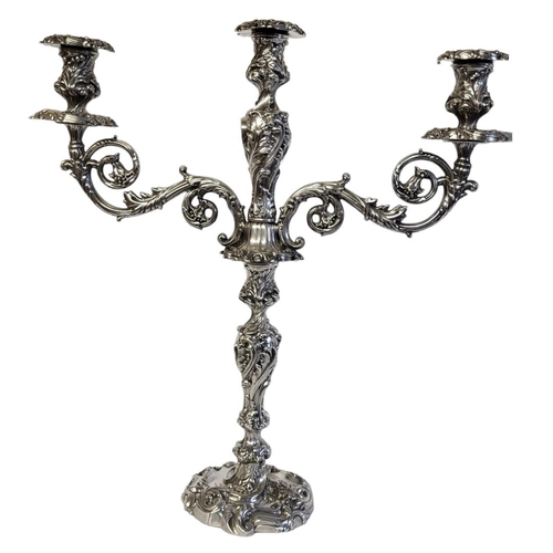 45 - WALKER AND HALL, A LARGE VICTORIAN SILVER CANDELABRA
Having two scrolled arms with embossed decorati... 