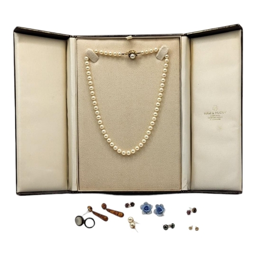 59A - A MID 20TH CENTURY HAM AND HUDDY NATURAL PEARL LADIES’ NECKLACE
Set with a 9ct gold clasp surrounded... 