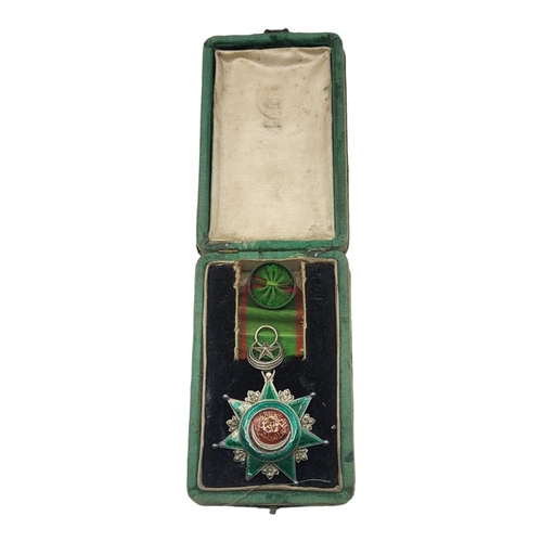 60 - A GOLD AND SILVER OTTOMAN EMPIRE ORDER OF OSMANIEH NECK BADGE, 1862 Silver seven pointed star with a... 