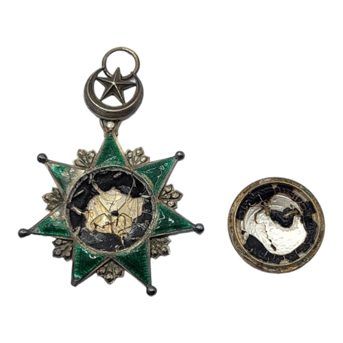 60 - A GOLD AND SILVER OTTOMAN EMPIRE ORDER OF OSMANIEH NECK BADGE, 1862 Silver seven pointed star with a... 