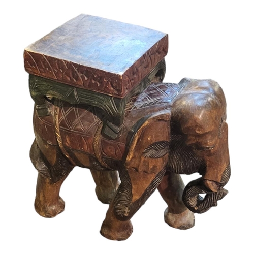 615 - A VINTAGE CARVED WOODEN INDIAN ELEPHANT STOOL
Standing pose with carved and painted decoration.
(app... 