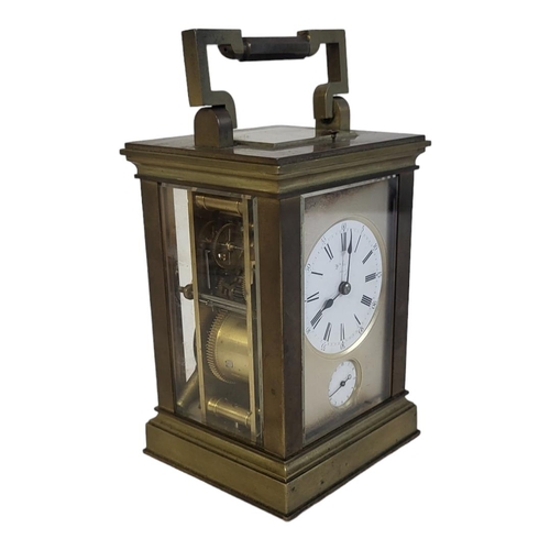 7 - A LATE 19TH/EARLY 20TH CENTURY GILT BRASS REPEATER ALARM  CARRIAGE CLOCK
Having a circular white dia... 