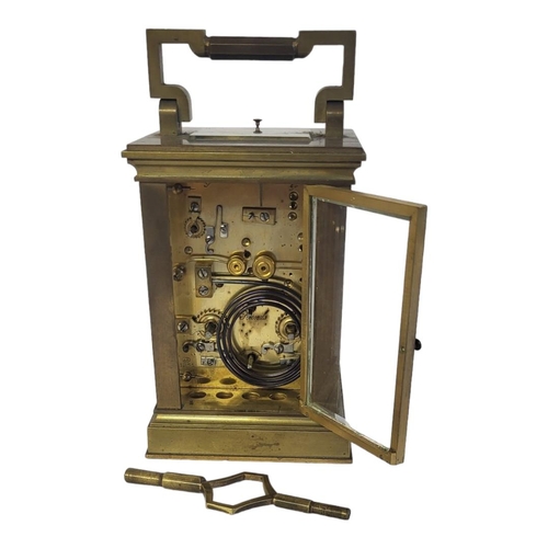 7 - A LATE 19TH/EARLY 20TH CENTURY GILT BRASS REPEATER ALARM  CARRIAGE CLOCK
Having a circular white dia... 