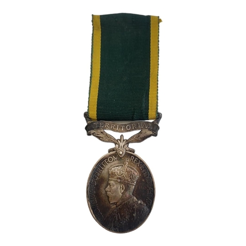 73 - 73
SILVER GEORGE V WORLD WAR II TERRITORIAL EFFICIENCY MEDAL
Ribbon and suspended bar attached, issu... 