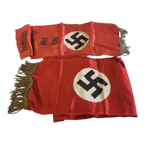 93 - TWO WWII GERMAN MILITARY SILK BANNERS
Each having a Swastika on red ground, one marked 'Reichsbahnau... 