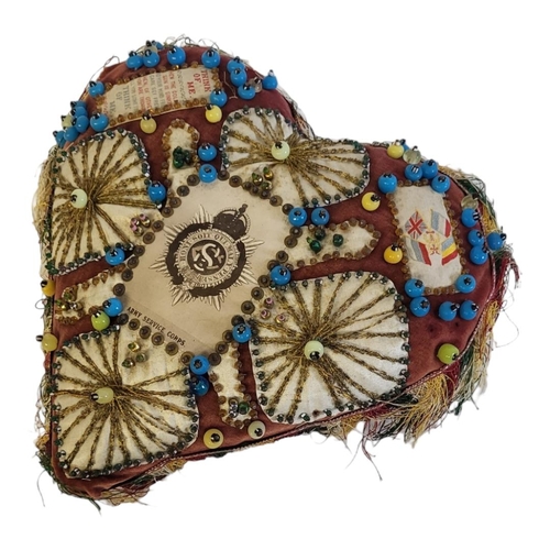 93A - A WWI BRITISH ARMY SERVICE CORPS 'SWEETHEART' CUSHION
Hand stitched with applied beadwork and silk c... 