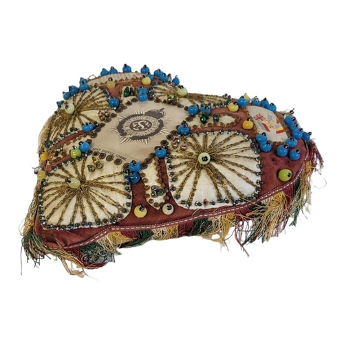 93A - A WWI BRITISH ARMY SERVICE CORPS 'SWEETHEART' CUSHION
Hand stitched with applied beadwork and silk c... 