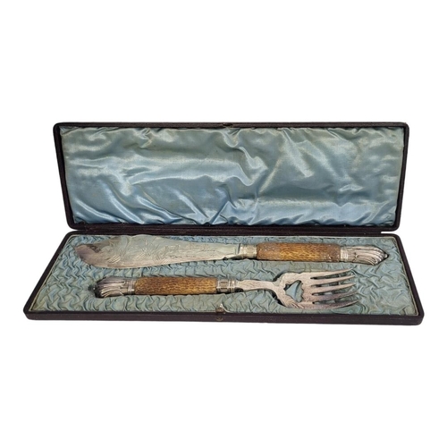71B - A PAIR OF SILVER PLATE AND HORN FISH SERVERS
The horn antler handles having silver plated mounts and... 