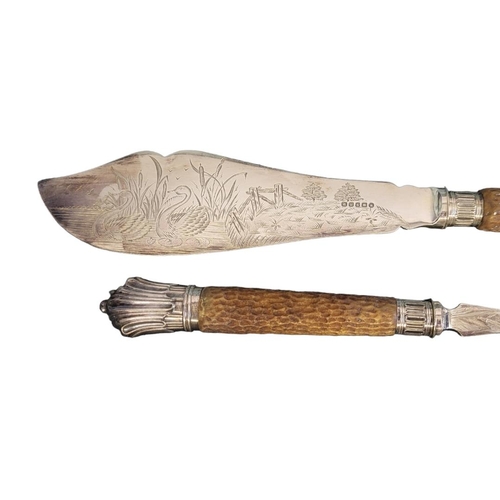 71B - A PAIR OF SILVER PLATE AND HORN FISH SERVERS
The horn antler handles having silver plated mounts and... 