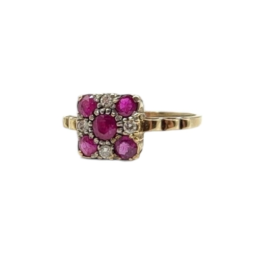 106 - A VINTAGE 9CT GOLD, RUBY AND DIAMOND CLUSTER RING
Having an arrangement of five round cut rubies edg... 