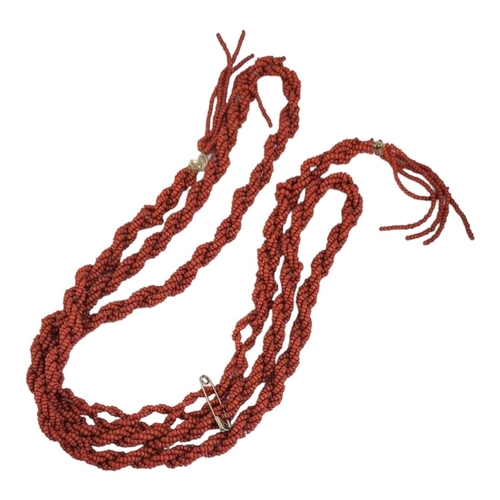 110 - AN EARLY 20TH CENTURY CHINESE CORAL NECKLACE
Three rows of coral beads in a twist design.
(approx 12... 