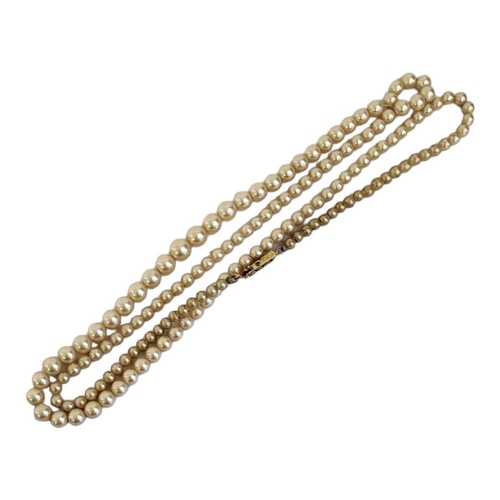 104 - A VINTAGE 9CT GOLD AND FAUX PEARL NECKLACE
The rectangular clasp with a graduated row of pearls.
(ap... 