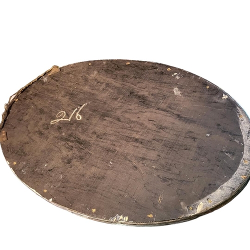 352 - AN ARTS AND CRAFTS SILVER PLATE ON COPPER OVAL MIRROR
With applied florets, shaped border and bevell... 