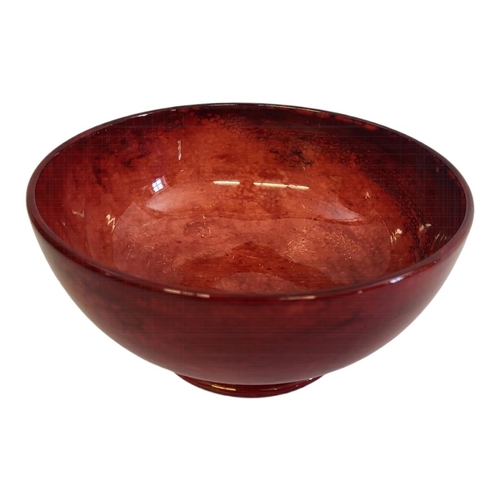 342 - AN EARLY 20TH CENTURY WILLIAM MOORCROFT FLAMBE CONICAL BODY PEDESTAL BOWL, CIRCA 1930 
Covered in ri... 