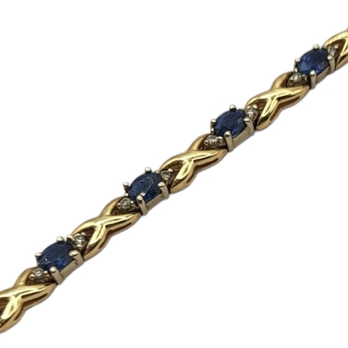 19 - A 14CT GOLD, SAPPHIRE AND DIAMOND BRACELET
The row of oval cut sapphires flanked by diamonds with cr... 