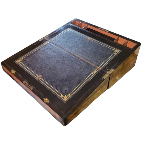 191A - A 19TH CENTURY WALNUT WRITING SLOPE
Having inlaid brass stringing, cartouche and escutcheon .
(appro... 