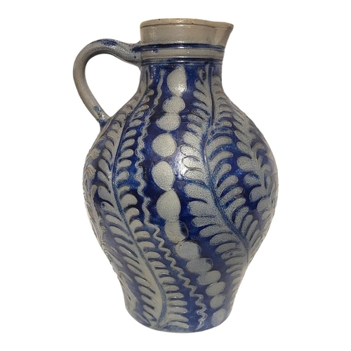 196 - A LARGE 19TH CENTURY GERMAN WESTERWALD STONEWARE STEIN JUG
Having a single handle, incised underglaz... 