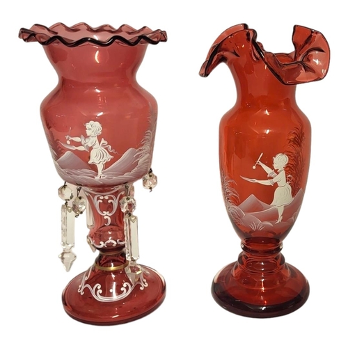 199 - A 20TH CENTURY CRANBERRY GLASS 'MARY GREGORY' DESIGN LUSTRE VASE
Having a piecrust edge and white en... 