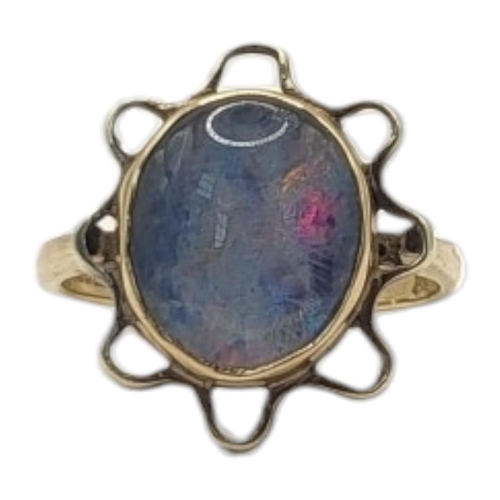 20 - A VINTAGE 9CT GOLD AND FIRE OPAL RING
Set with an oval cut stone in a pierced mount.
(opal approx 0.... 