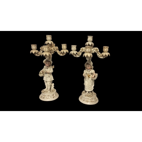 200 - SITZENDORF, A PAIR OF 19TH CENTURY GERMAN PORCELAIN FIGURAL CANDELABRA
Young male and female wearing... 