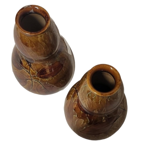 209 - A PAIR OF LATE 19TH/EARLY 20TH CENTURY ROYAL DOULTON STONEWARE VASES
Double gourd form with incised ... 