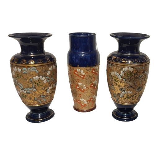 210 - A PAIR OF ROYAL DOULTON AND SLATERS STONEWARE POTTERY VASES
Impressed lace design on blue ground, to... 