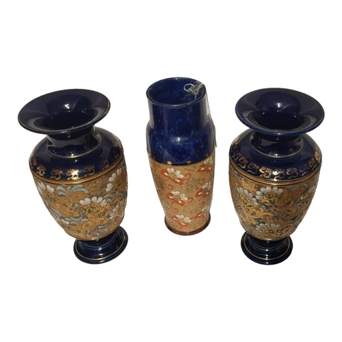 210 - A PAIR OF ROYAL DOULTON AND SLATERS STONEWARE POTTERY VASES
Impressed lace design on blue ground, to... 