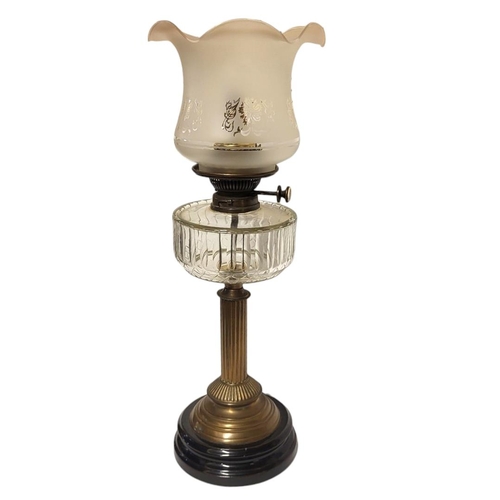 214 - A STANDARD VICTORIAN BRASS OIL LAMP
With cut glass clear reservoir, raised on a circular black base,... 