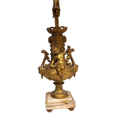216 - A PAIR OF EARLY 20TH CENTURY FRENCH GILDED SPELTER CHERUBS LAMP BASES
Both having scrolling handles ... 