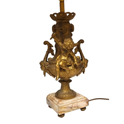 216 - A PAIR OF EARLY 20TH CENTURY FRENCH GILDED SPELTER CHERUBS LAMP BASES
Both having scrolling handles ... 