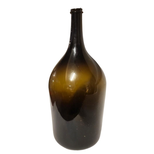 218 - A MAGNUM SIZE LATE 19TH/EARLY 20TH CENTURY SHAFT AND GLOBE WINE BOTTLE 
With a string rim. 
(h 52cm)... 
