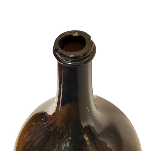 218 - A MAGNUM SIZE LATE 19TH/EARLY 20TH CENTURY SHAFT AND GLOBE WINE BOTTLE 
With a string rim. 
(h 52cm)... 