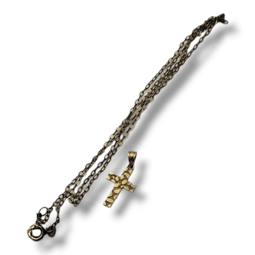 22 - A VINTAGE 14CT GOLD CRUCIFIX PENDANT
The textured crucifix on a plain 14ct gold necklace.
(crucifix ... 