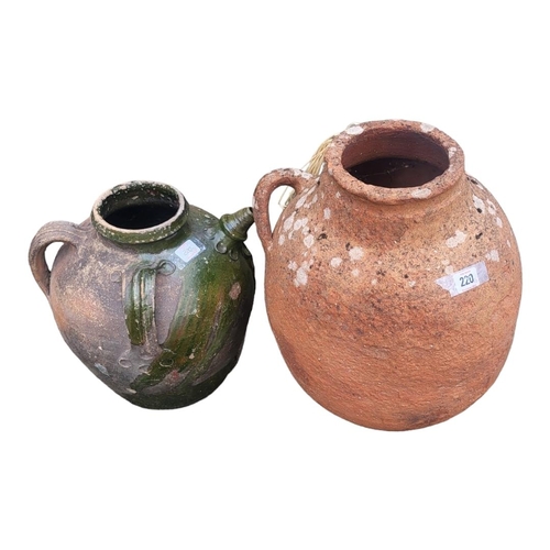 220 - A 20TH CENTURY GARDEN TERRACOTTA TWIN HANDLED VASE
Along with Spanish style terracotta olive oil ewe... 