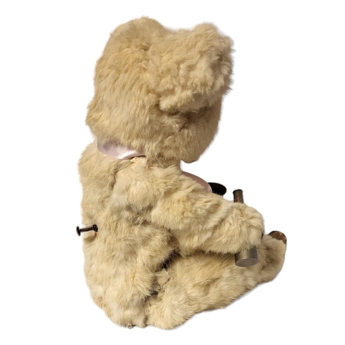 247 - A LATE 19TH/EARLY 20TH CENTURY 'DRINKING BEAR' AUTOMATON
Having white animal fur with skin hide hand... 