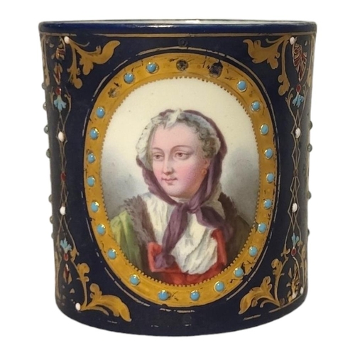 252 - A 19TH CENTURY SEVRES STYLE HARD PASTE PORCELAIN JEWELLED CABINET CUP AND SAUCER 
Painted and enamel... 