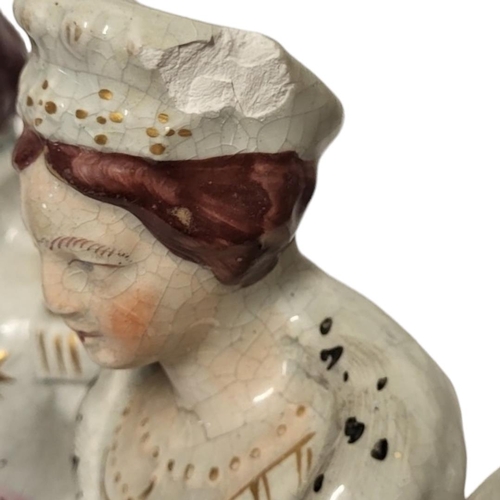 269 - A VICTORIAN STAFFORDSHIRE FLATBACK CRIMEAN POTTERY GROUP 
Depicting Queen Victoria, King of France a... 
