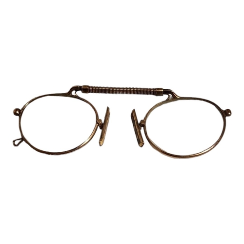 27 - A PAIR OF VICTORIAN GOLD PLATED PINCE NEZ OVAL SPECTACLES
With spring frame.
(approx 10cm)

Conditio... 