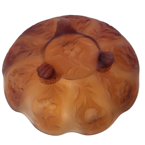 274 - AN EARLY 20TH CENTURY AMBER GLASS BOWL
Having a scalloped edge and embossed floral decoration to rev... 