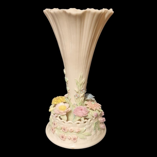 277 - BELLEEK, A 20TH CENTURY IRISH PORCELAIN TRUMPET VASE
The central reeded trumpet with applied floral ... 